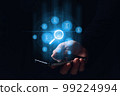 A person holding a smartphone leads the search and verification of electronic documents. Hologram graphics. 99224994