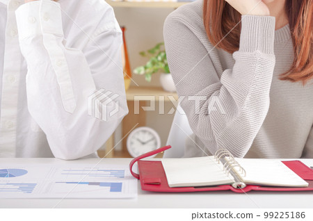 Young men and women having a serious discussion Young men and women having a serious discussion 99225186
