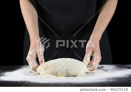 Cook's hands kneading dough for home baking. Food concept Cook's hands kneading dough for home baking. Food concept 99225519