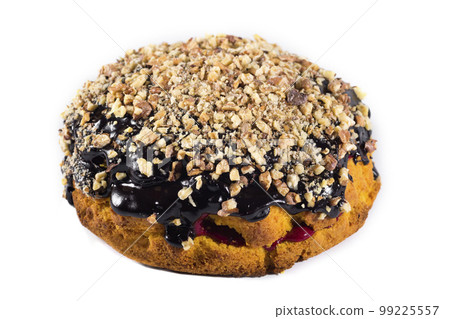 Sponge cake with nuts isolated on white. Close-up. Homemade baking Sponge cake with nuts isolated on white. Close-up. Homemade baking 99225557