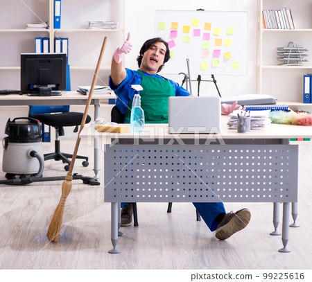 Male handsome professional cleaner working in the office 99225616