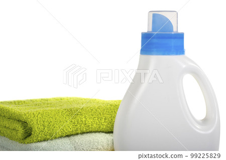 Detergent container and towels on a white isolated background. Cleaning concept Detergent container and towels on a white isolated background. Cleaning concept 99225829