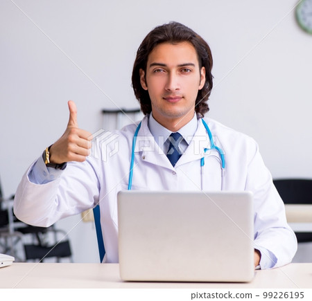 Young handsome doctor in telemedicine concept Young handsome doctor in telemedicine concept 99226195