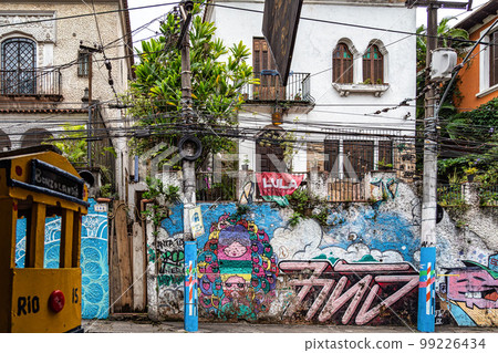 Graffiti street art murals line the streets and back alleys of Rio de Janeiro, Santa Teresa district in Brazil 99226434