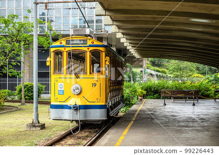 The famous old tram Bonde de Santa Teresa in Rio de Janeiro, Brazil. Yellow tram traveling through Rio de Janeiro The famous old tram Bonde de Santa Teresa in Rio de Janeiro, Brazil. Yellow tram traveling through Rio de Janeiro 99226443