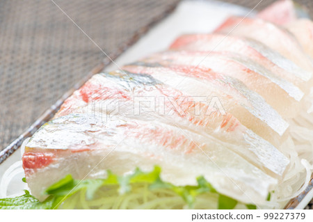 Close-up of striped horse mackerel sashimi. 99227379