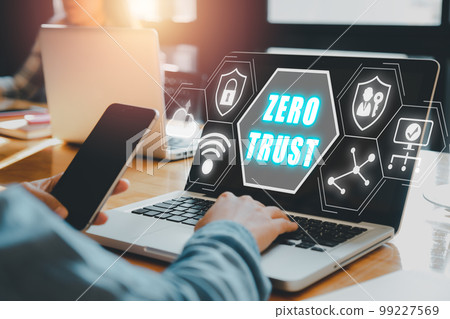 zero trust security concept, Person using computer with zero trust icon on virtual screen. 99227569