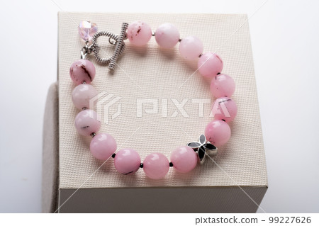 author bracelet with natural cherry jasper. fashion and jewelry concept author bracelet with natural cherry jasper. fashion and jewelry concept 99227626