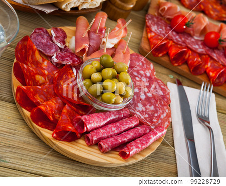 Spanish sausage sliced - chorizo, fuet, jamon, salami, bacon 99228729