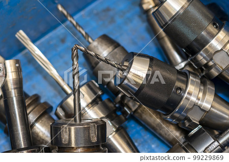The group of various size of drill tools in the container box. The group of various size of drill tools in the container box. 99229869