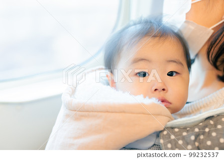 Traveling on public transport with a baby Traveling on public transport with a baby 99232537