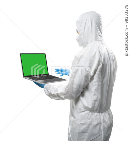 Worker wears medical protective suit or white coverall suit with blank screen laptop isolated Worker wears medical protective suit or white coverall suit with blank screen laptop isolated 99233278
