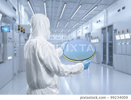 Worker or engineer wears medical protective suit or coverall suit with silicon wafer 99234009