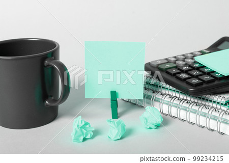 Coffee Cup Standing on Desk. Important infrormation written on paper. Different Office Supplies, Pencils, Pens, Marckers. Computer keyboard. Text on wood table. Coffee Cup Standing on Desk. Important infrormation written on paper. Different Office Supplies, Pencils, Pens, Marckers. Computer keyboard. Text on wood table. 99234215
