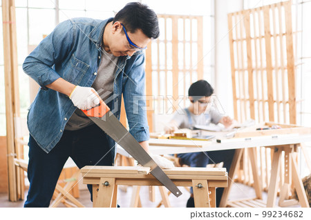 Southeast asian family father and son diy or repair for crafts skill at home workshop Southeast asian family father and son diy or repair for crafts skill at home workshop 99234682
