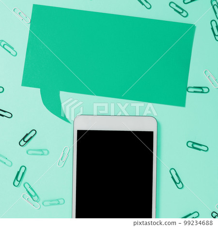 Important Message Presented On Phone On Desk With paperclips, Paper. Crutial Information Shown On Cellphone Screen Placed On Table. New Ideas On Mobile Phone. 99234688