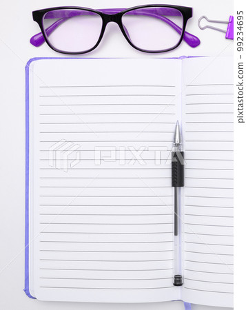 Office Supplies Over Desk With Keyboard And Glasses And Coffee Cup For Working Remotely, Assorted School Utilities For Studying With Hot Drink And Eyeglasses. Office Supplies Over Desk With Keyboard And Glasses And Coffee Cup For Working Remotely, Assorted School Utilities For Studying With Hot Drink And Eyeglasses. 99234695