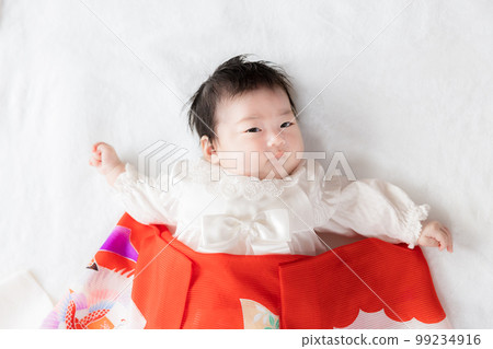 2 month old baby in baby dress 99234916