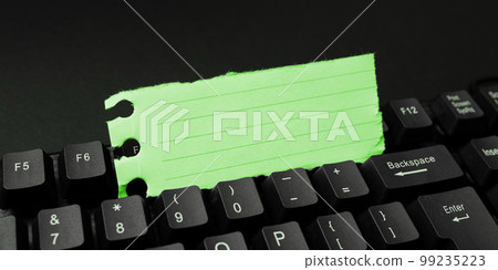 Colored sticker lying on black keyboard. Important information written over paper. Image with school supplies. Multiple Assorted Collection Office Stationery. 99235223