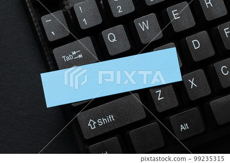 Colored sticker lying on black keyboard. Important information written over paper. Image with school supplies. Multiple Assorted Collection Office Stationery. Colored sticker lying on black keyboard. Important information written over paper. Image with school supplies. Multiple Assorted Collection Office Stationery. 99235315