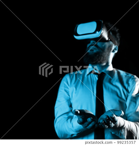 Man Wearing Vr Glasses And Holding Important Messages In Hands. Businessman Having Virtual Reality Eyeglasses And Showing Crutial Informations. 99235357