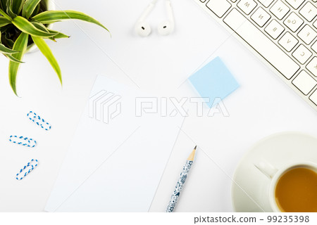 Coffee Cup Standing on Desk. Important infrormation written on paper. Different Office Supplies, Pencils, Pens, Marckers. Computer keyboard. Text on wood table. Coffee Cup Standing on Desk. Important infrormation written on paper. Different Office Supplies, Pencils, Pens, Marckers. Computer keyboard. Text on wood table. 99235398