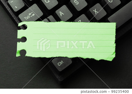 Colored sticker lying on black keyboard. Important information written over paper. Image with school supplies. Multiple Assorted Collection Office Stationery. Colored sticker lying on black keyboard. Important information written over paper. Image with school supplies. Multiple Assorted Collection Office Stationery. 99235400