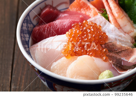 Bowl of rice topped with sashimi Bowl of rice topped with sashimi 99235646