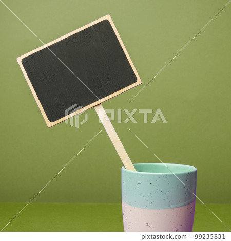 Coffee Cup Standing on Desk. Important infrormation written on paper. Different Office Supplies, Pencils, Pens, Marckers. Computer keyboard. Text on wood table. Coffee Cup Standing on Desk. Important infrormation written on paper. Different Office Supplies, Pencils, Pens, Marckers. Computer keyboard. Text on wood table. 99235831