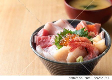 Bowl of rice topped with sashimi Bowl of rice topped with sashimi 99235955
