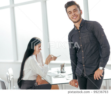 young business man standing in his office young business man standing in his office 99236763