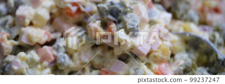 Olivier salad and food ingredients green peas cucumber potatoes sausage and mayonnaise 99237247
