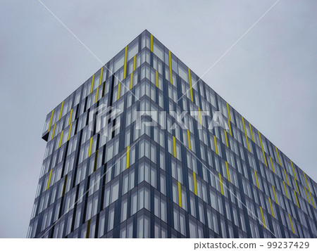 Exterior of beautiful modern skyscraper against cloudy sky, low angle view Exterior of beautiful modern skyscraper against cloudy sky, low angle view 99237429