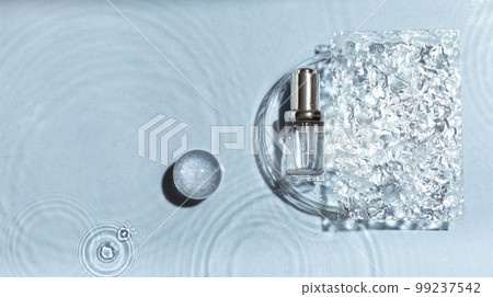 Cosmetic spa medical skincare, glass serum bottle in petri dish with collagen on blue water background with waves. 99237542