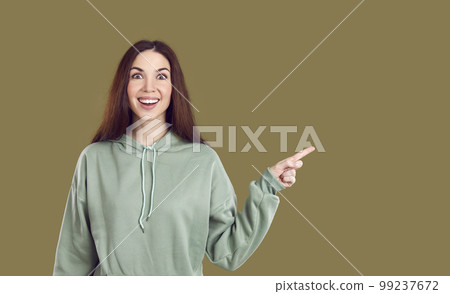 Enthusiastic joyful surprised woman introduce incredible offer pointing finger at copy space. Enthusiastic joyful surprised woman introduce incredible offer pointing finger at copy space. 99237672