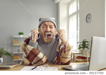 Senior man gets angry and cries when he has to pay for expensive heating in cold winter 99237700