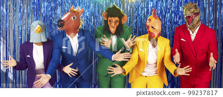 Group of men and women in colorful suits and funny animal masks having fun at party 99237817