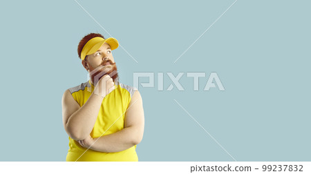 Chubby man on blue copy space background thinking about his weight loss workouts 99237832