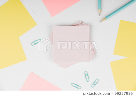 Notebook and Colored Papers Stickers Lying On White Desk. Multiple Assorted Collection Office Stationery. Photo With Pens Pencils Rullers Calculators. 99237956