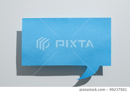 Color paper in shape of dialog box with important message. Infromation written on sticker. Different office stationery. Calculator, pencils, pens laing white table. Color paper in shape of dialog box with important message. Infromation written on sticker. Different office stationery. Calculator, pencils, pens laing white table. 99237981