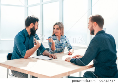 managers and job seeker sitting at the table during the interview managers and job seeker sitting at the table during the interview 99238747