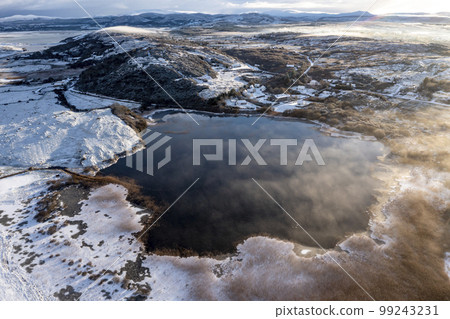Aerial view of Lake Clooney by Portnoo in County Donegal, Ireland. 99243231