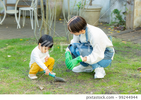 A woman gardening in the garden A woman gardening in the garden 99244944