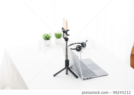 A table in a room with a distribution environment for laptops and smartphones 99245212