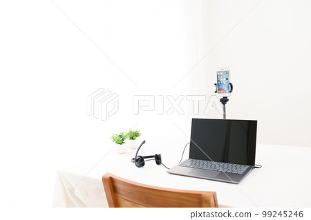 A table in a room with a distribution environment for laptops and smartphones A table in a room with a distribution environment for laptops and smartphones 99245246