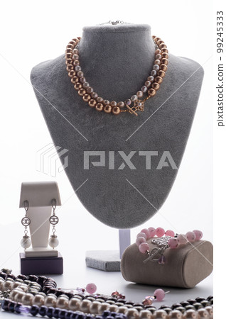 author jewelry demonstrated against white background. fashion and jewelry concept author jewelry demonstrated against white background. fashion and jewelry concept 99245333