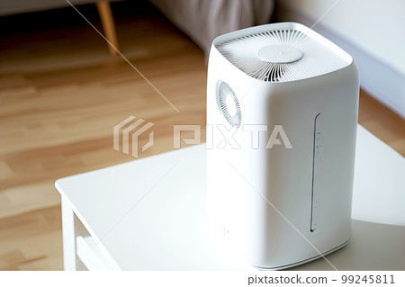 air purifier in room white device with tubes on table 99245811