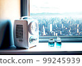 air purifier in room with mask and nebulizer against background of city 99245939