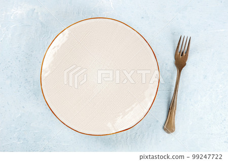 An empty plate with a fork, overhead flat lay shot, the concept of food 99247722