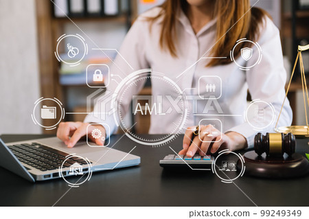 AML Anti Money Laundering Financial Bank Business Concept. judge in a courtroom using laptop and tablet with AML anti money laundering icon on virtual screen. . AML Anti Money Laundering Financial Bank Business Concept. judge in a courtroom using laptop and tablet with AML anti money laundering icon on virtual screen. . 99249349